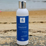 Un flacon de shampoing revitalisant de la marque Passion Marine