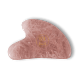 Un gua sha rose de la marque Ya Beauty