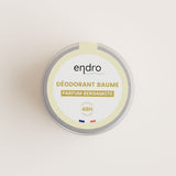 Un pot en verre avec un couvercle en aluminium de déodorant solide baume parfum bergamote de la marque Endro