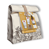 Sur fond transparent un coffret cadeau en toile appelé "Collection le Baobab" contenant des soins visage, corps et cheveux de la marque Comptoir des Huiles