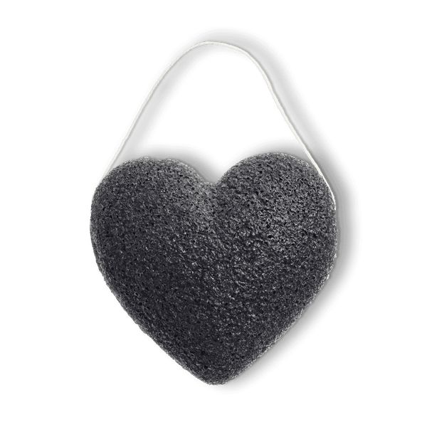 Sur fond transparent une éponge konjac noire