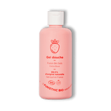 Un flacon en plastique rose de gel douche fraise des bois de la marque Fun!Ethic